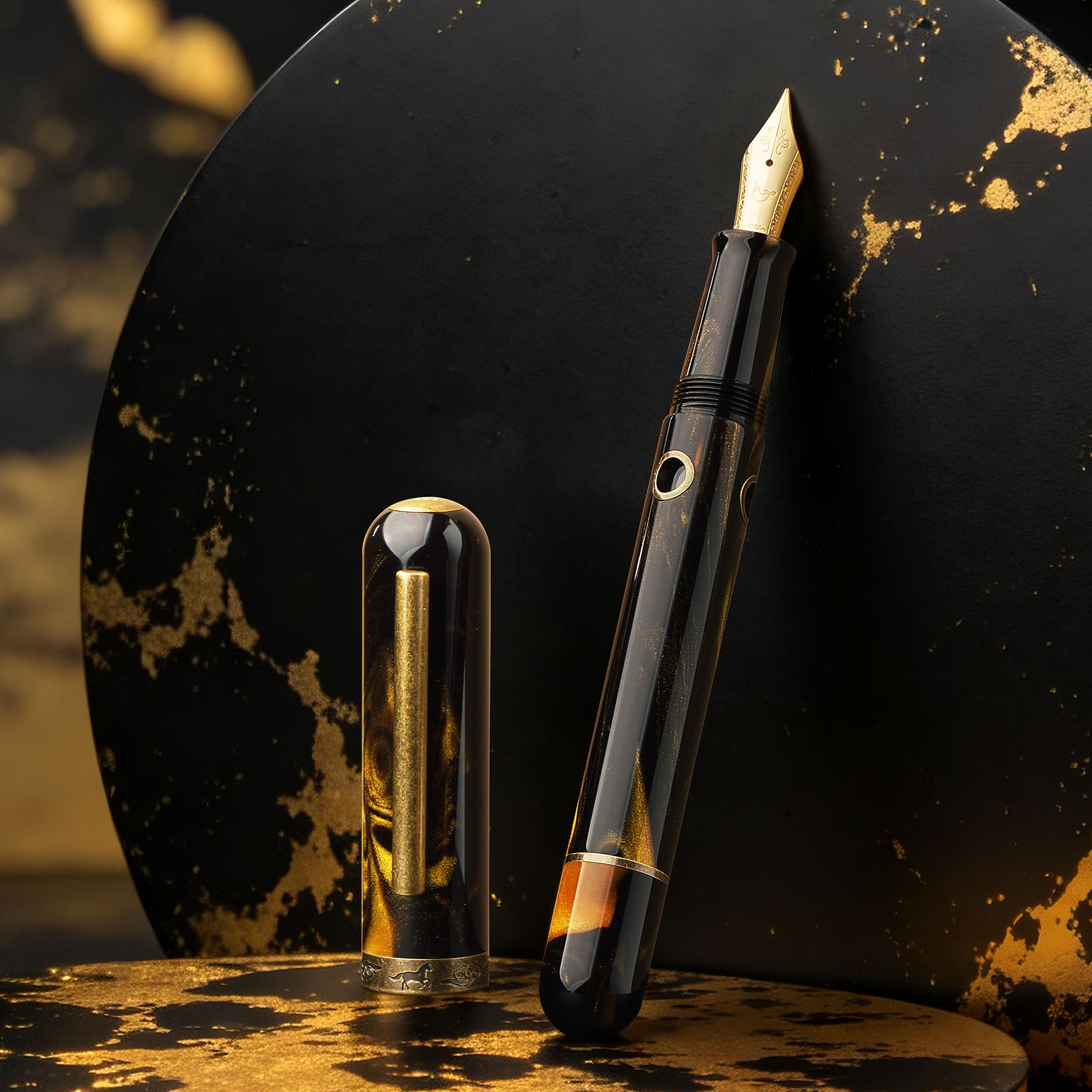 Nahvalur Nautilus Year of the Horse Fountain Pen with swirling gold, brown, and black body and bronze trims