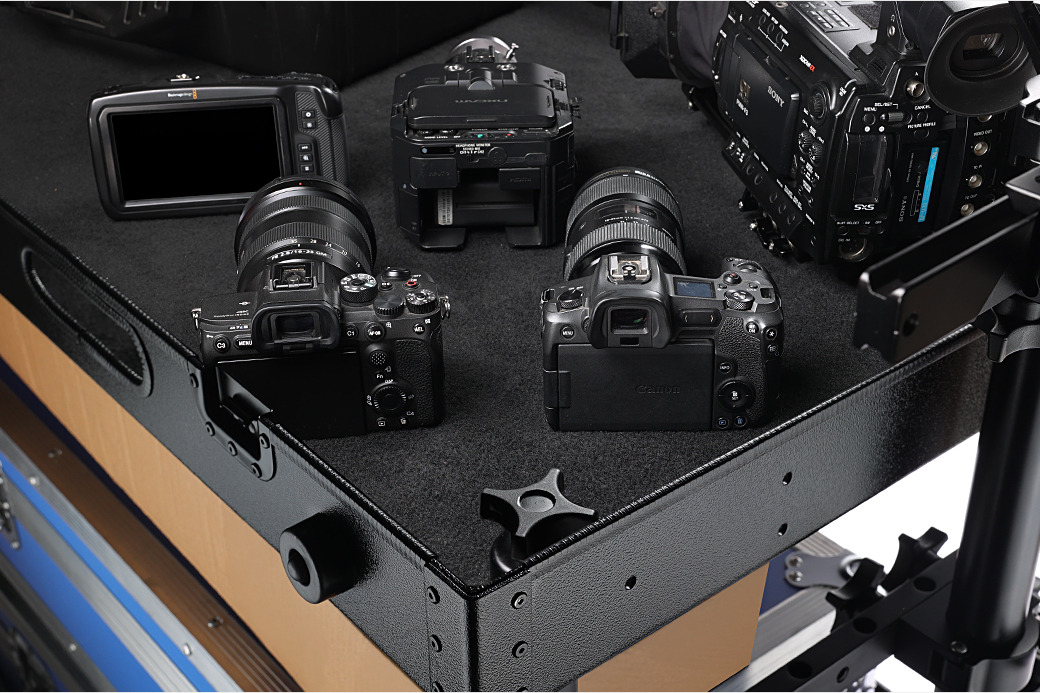 Carpeted shelf of the Victor Lite V2 with cameras and lenses