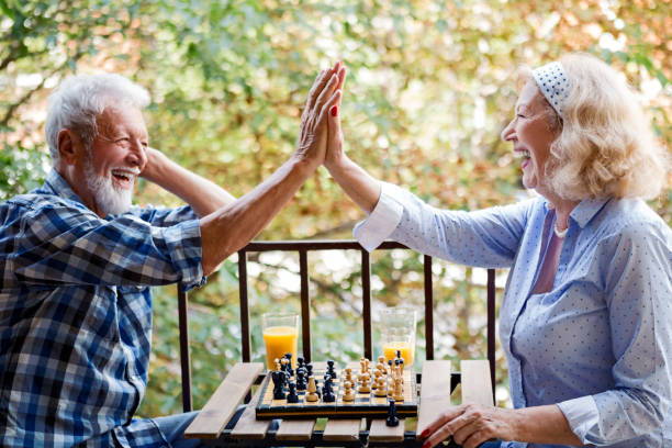 Men playing chess. Active seniors. Seniors. 