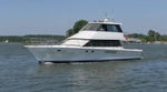 Side profile Peter's white Salthouse Sovereign 60 motor yacht cruising on open water photo 1