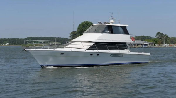 Side profile Peter's white Salthouse Sovereign 60 motor yacht cruising on open water photo 1