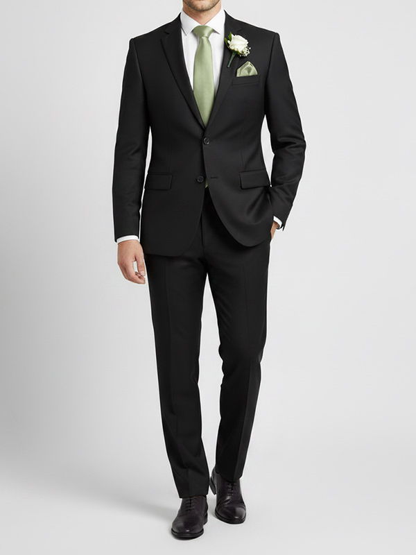 Groomsman wearing a sage tie with a black suit for a formal look