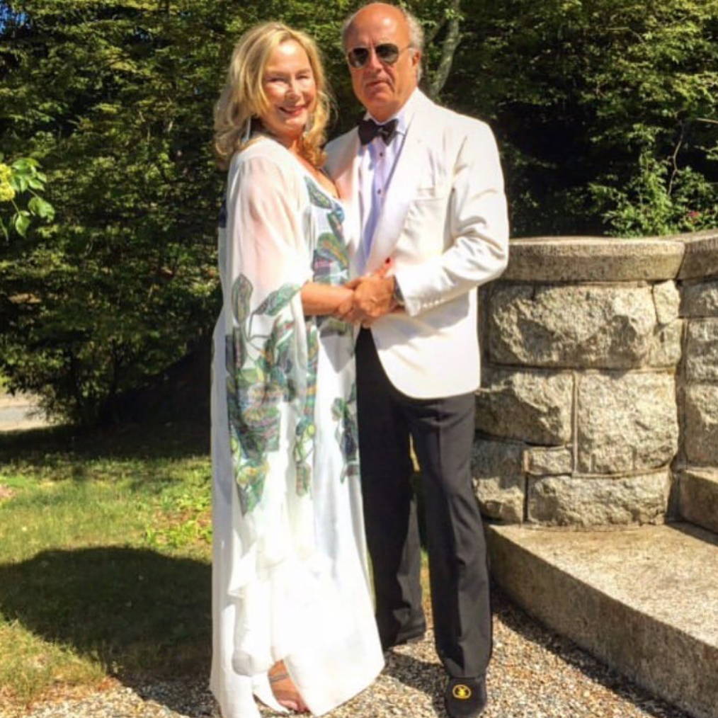 Ala Isham wearing custom mother of the bride silk dress with her husband by Ala von Auersperg