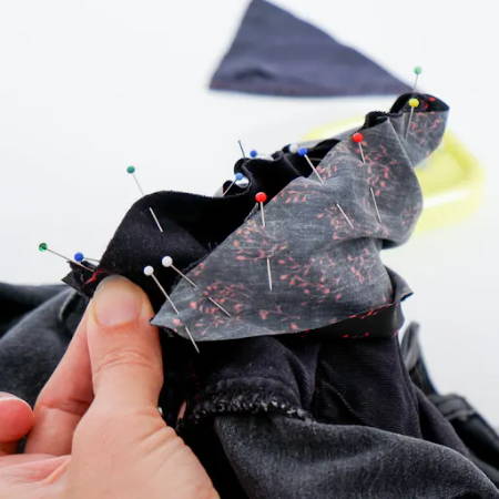 attach the new fabric onto piece the old pocket using pins