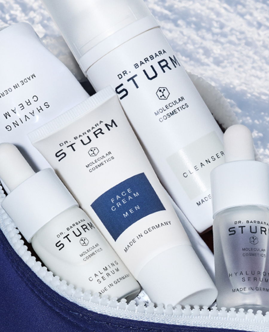 Various skincare products from Dr. Barbara Sturm in a cosmetic bag.