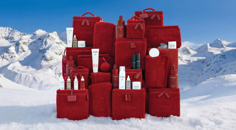 Red kits in a snowy mountain landscape.