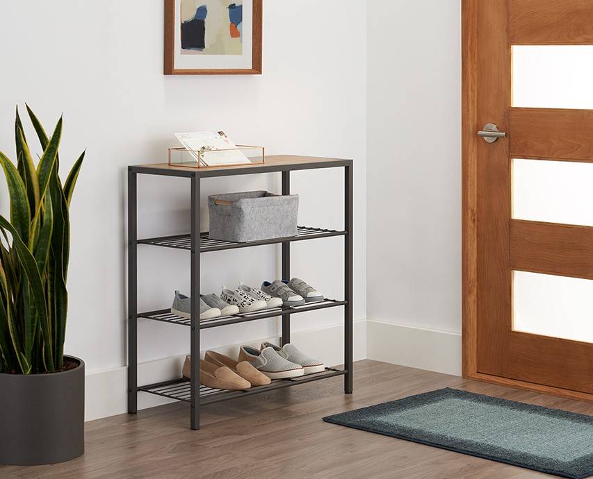 Shoe rack in an entryway with shoes on shelves