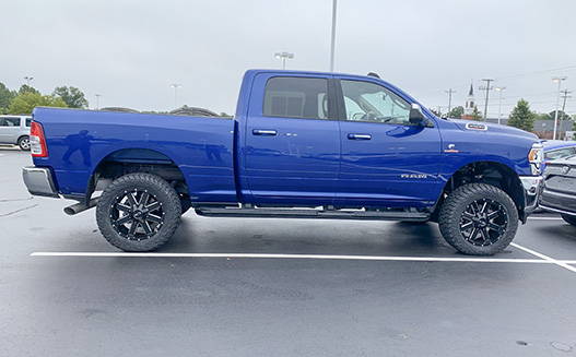 truck with lift kit, wheels and tires for local dealership