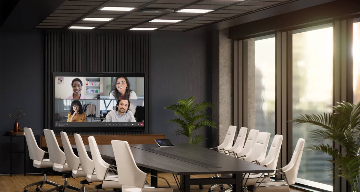 Enterprise boardroom running a video call on an integrated AV system