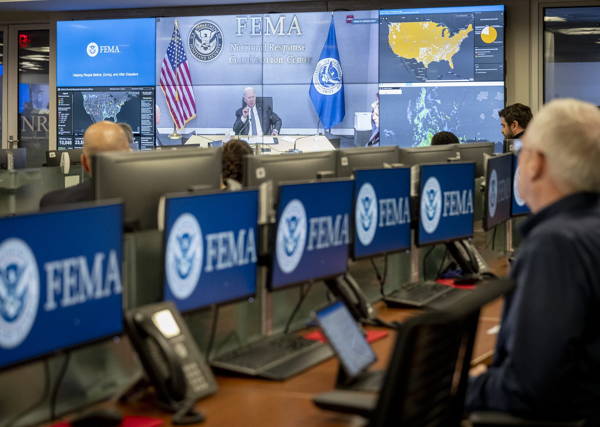 Government emergency operations centre with a video wall and operator consoles