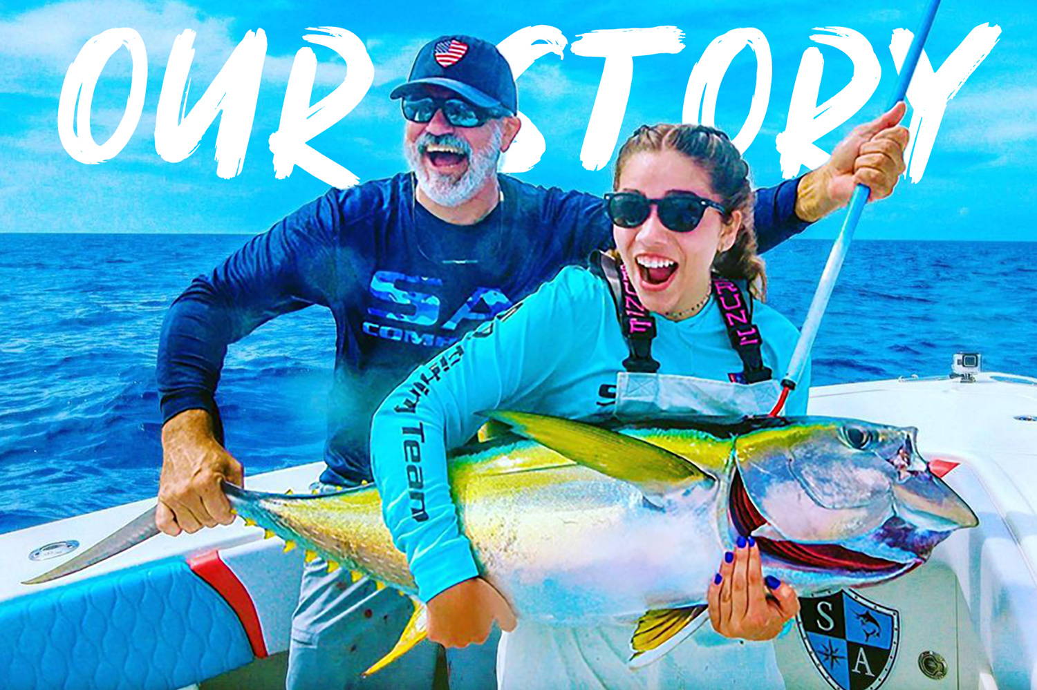 Our Story. A lady and a man holding up a very large fish together. They are both wearing SA Company performance shirts.