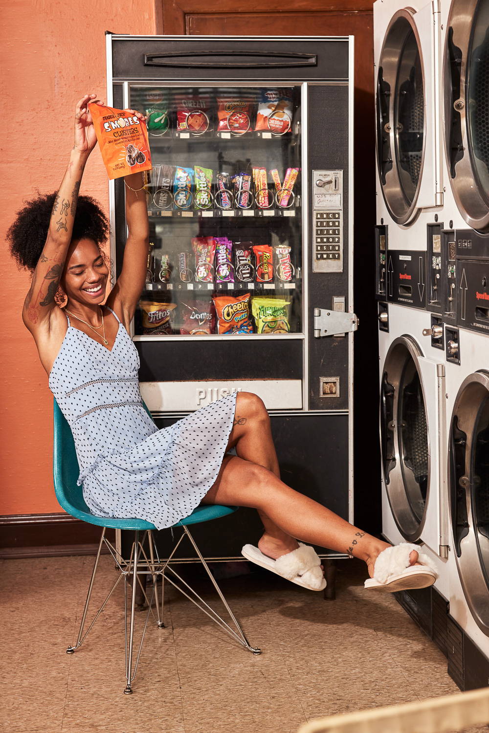 Trixxi Back to school embracing dorm life doing laundry in a sky blue dot printed tier strappy dress.