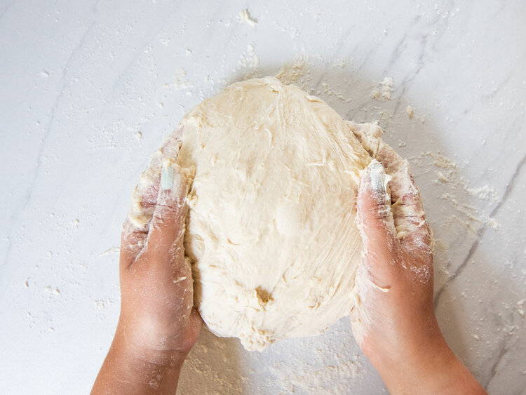 Turn dough out onto floured surface - How to Make Everything Bagels