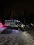 Ford Transit covered multicolor Christmas lights night snowy slush headlight glow Taylor's 228H gallery photo 4