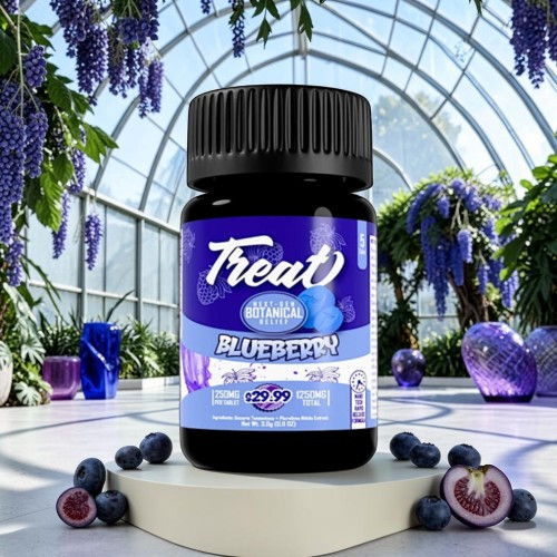 Bottle of blueberry-flavored treat in a botanical garden setting.