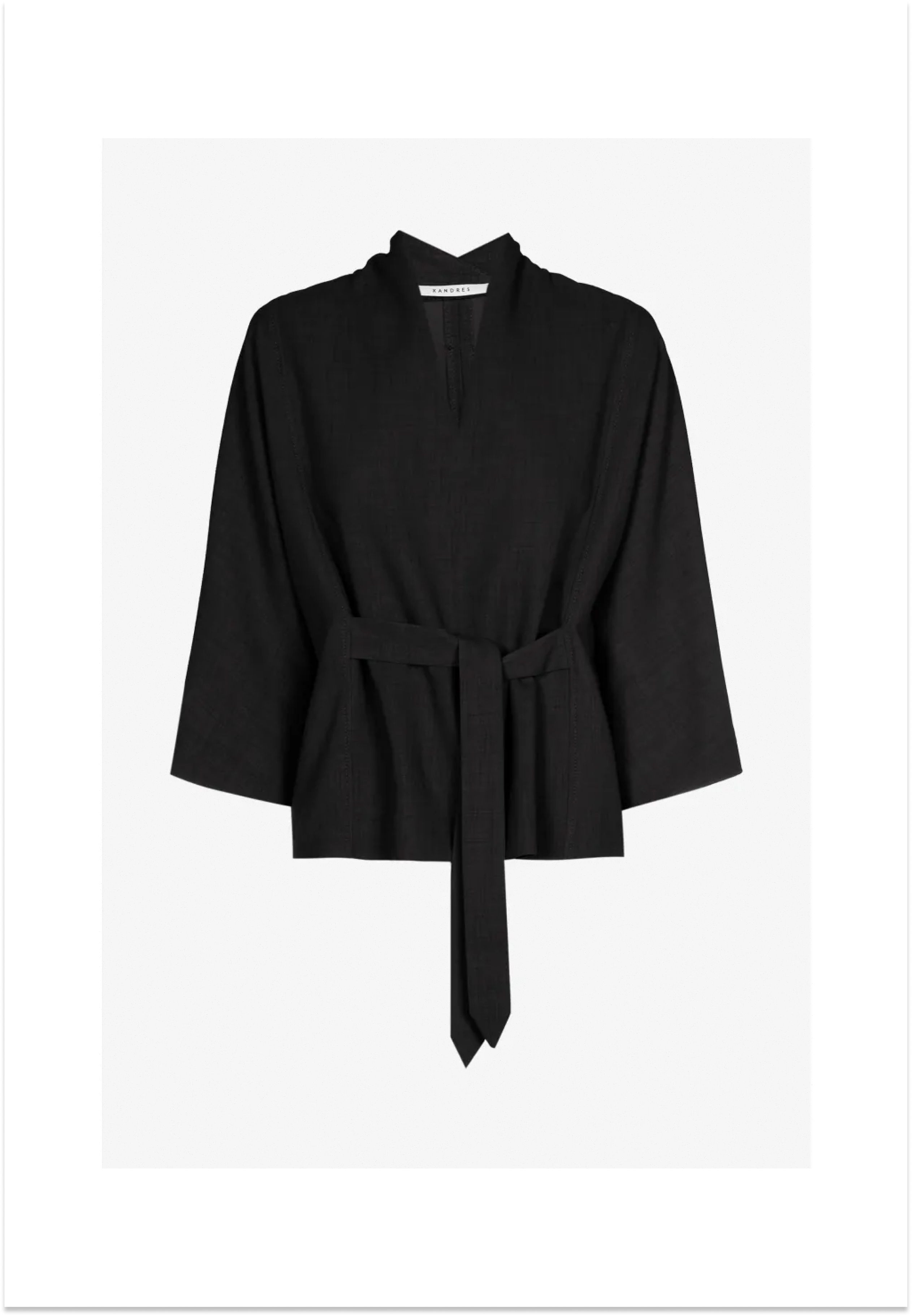 Black wrap-style top with a tie belt and wide sleeves.