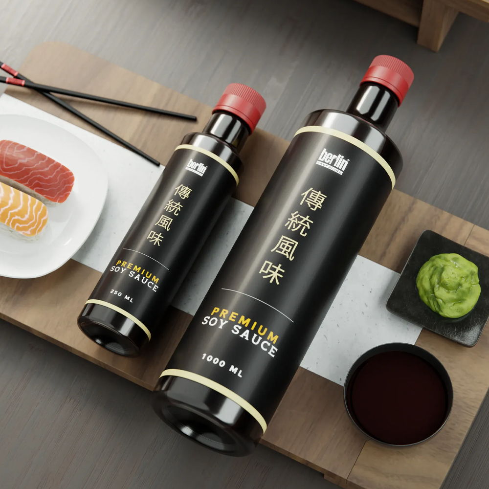 Bottles of soy sauce with sushi, wasabi, and dipping sauce on a wooden tray.