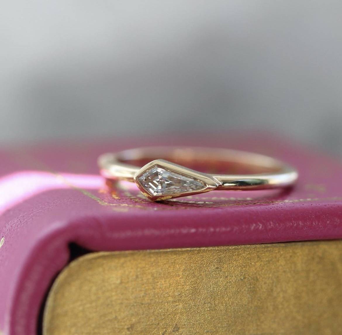 diamond ring on a custom kitty baxter book ring box