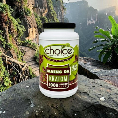Container of Maeng Da Kratom on a rocky surface with lush background.