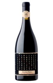 Bottle of red wine with a decorative black label.