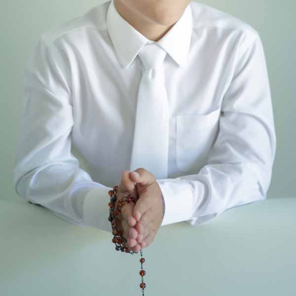 A boy dressed in white for Communion