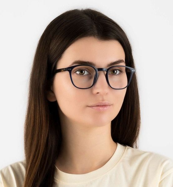 woman wearing Dare Navy hypoallergenic bio-acetate eyeglasses on a white background