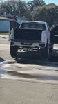 Rear view at car wash showing white horns under bumper on Joel's Silverado with tailgate down photo 4