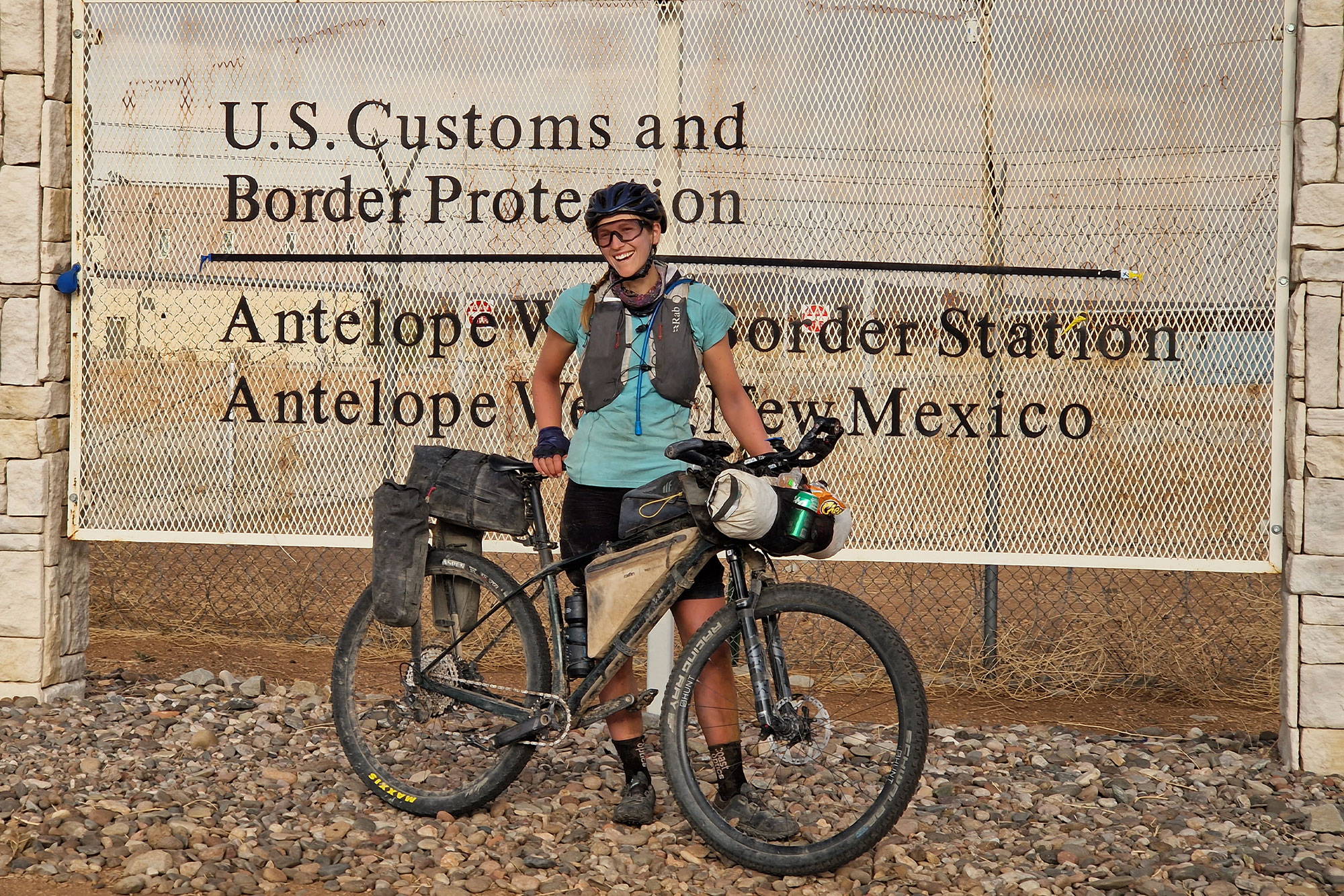 Gail with her bike at the US/Mexico border