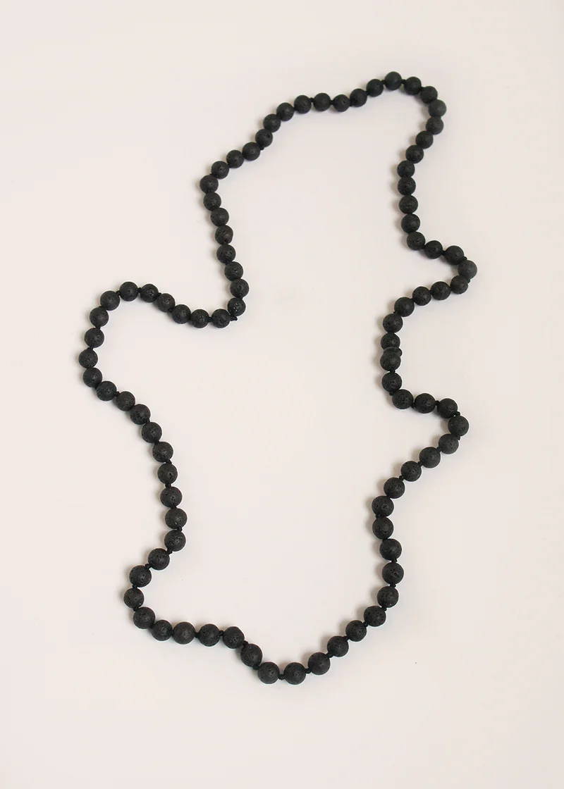 A necklace comprised of chunky black lava beads