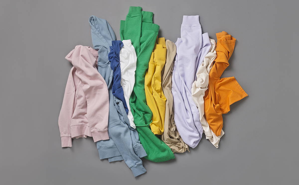 A bunch of Colorful Standard sweatshirts