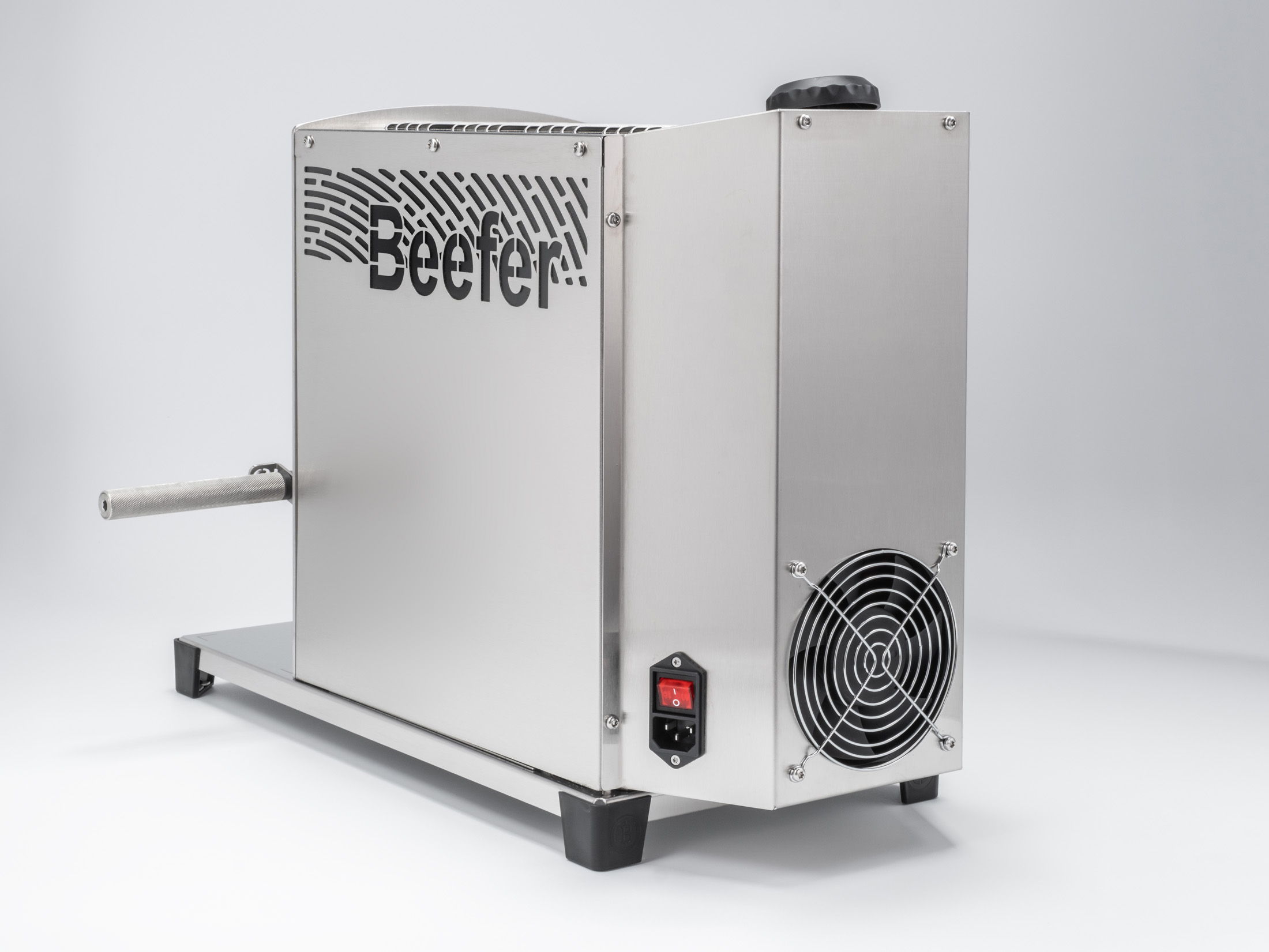 Stainless steel cooking appliance with a handle and ventilation.