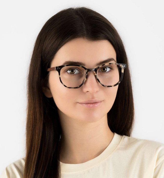 woman wearing Faith Ivory, geometric eyeglasses for oblong faces, on a white background