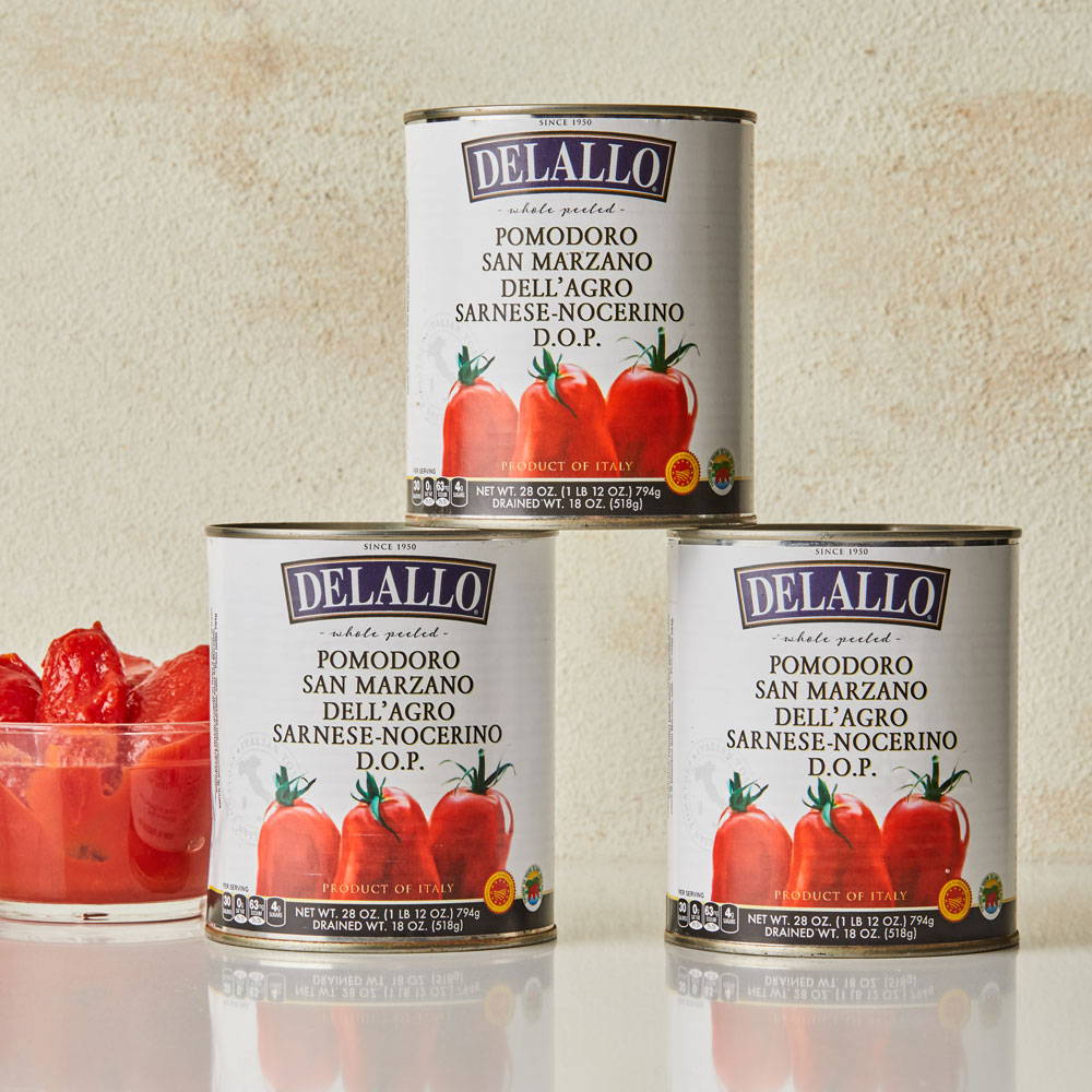 Three stacked cans of DeLallo San Marzano Tomatoes