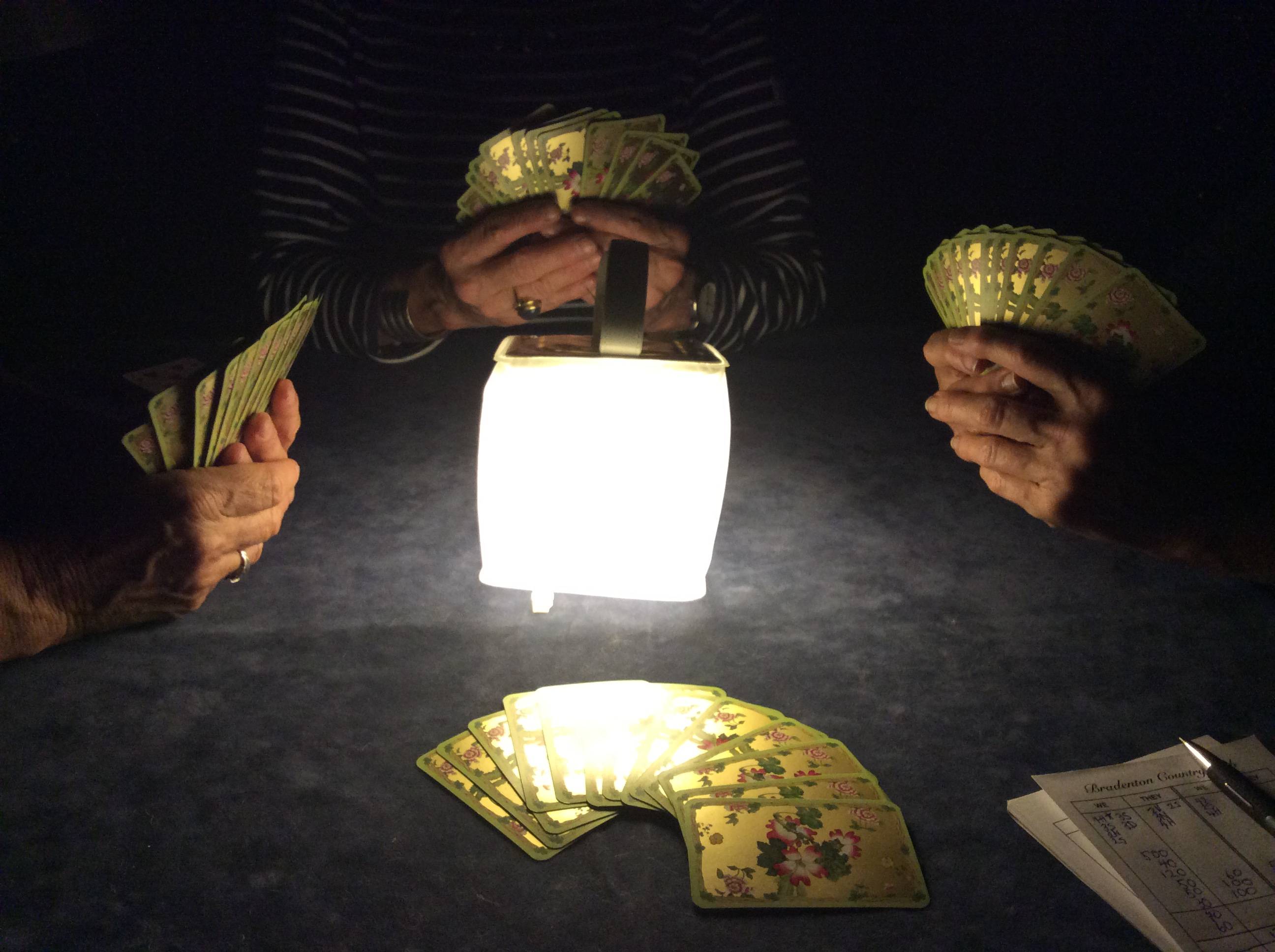 Play cards in the dark with your LuminAID lantern. 