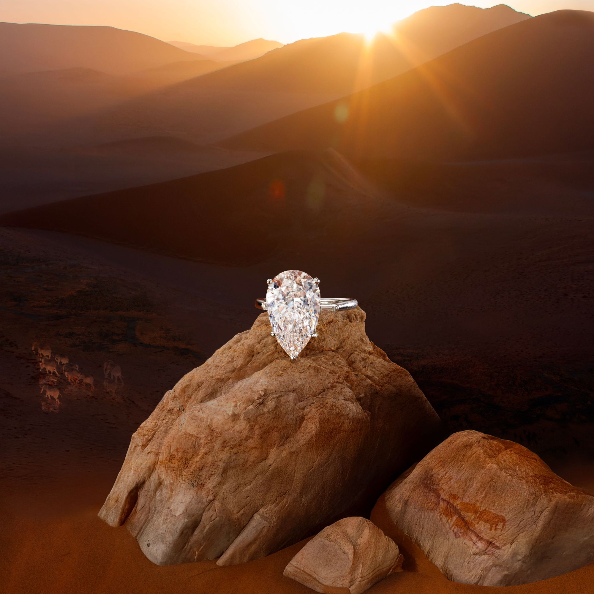pear shaped diamond ring on a rock with desert background