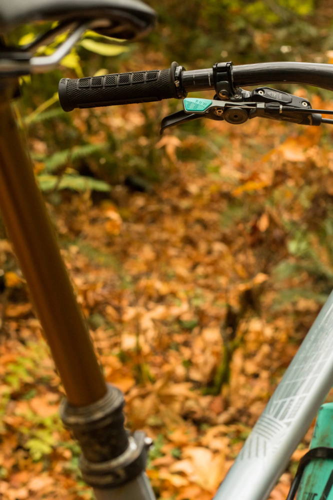 PNW Components Loam Lever in seafoam teal on a kona process