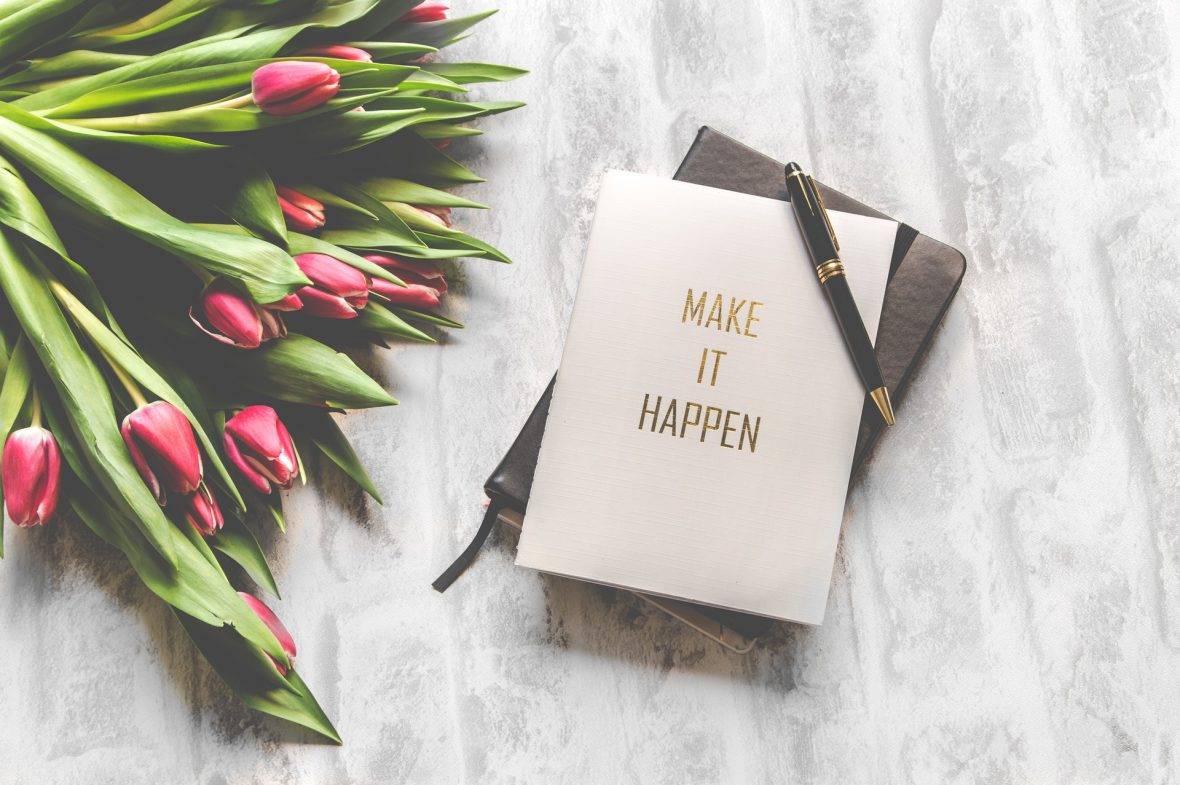 Planner On Table With Flowers