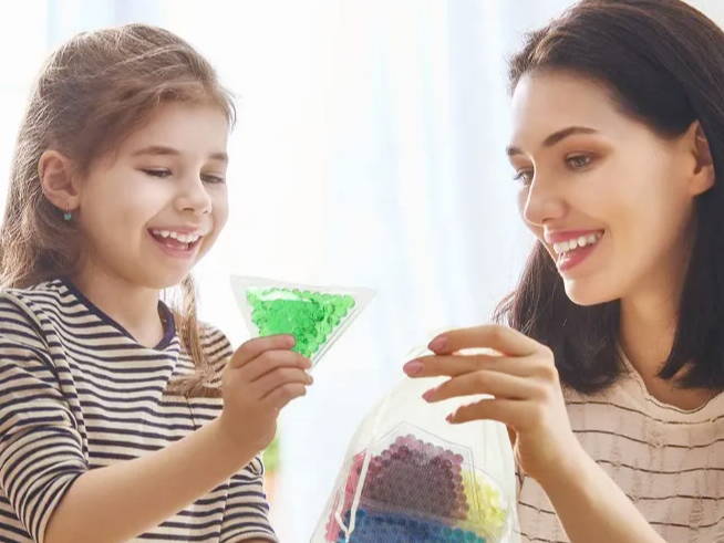 sensory fidgets, water bead fidgets, mom and daughter playing with fidgets