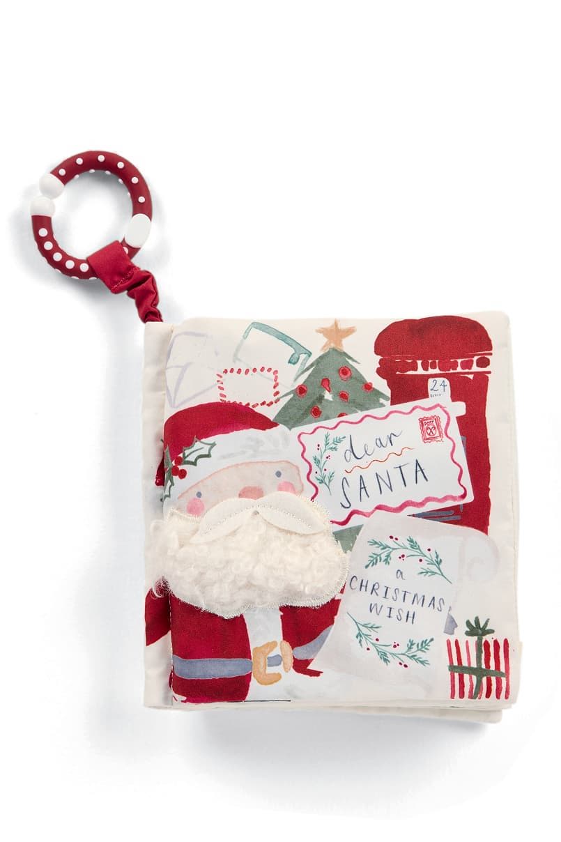 Christmas-themed fabric book with Santa design and a clip.