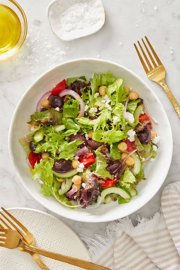 Simple side salad with chickpeas, red onions and crumbled feta cheese