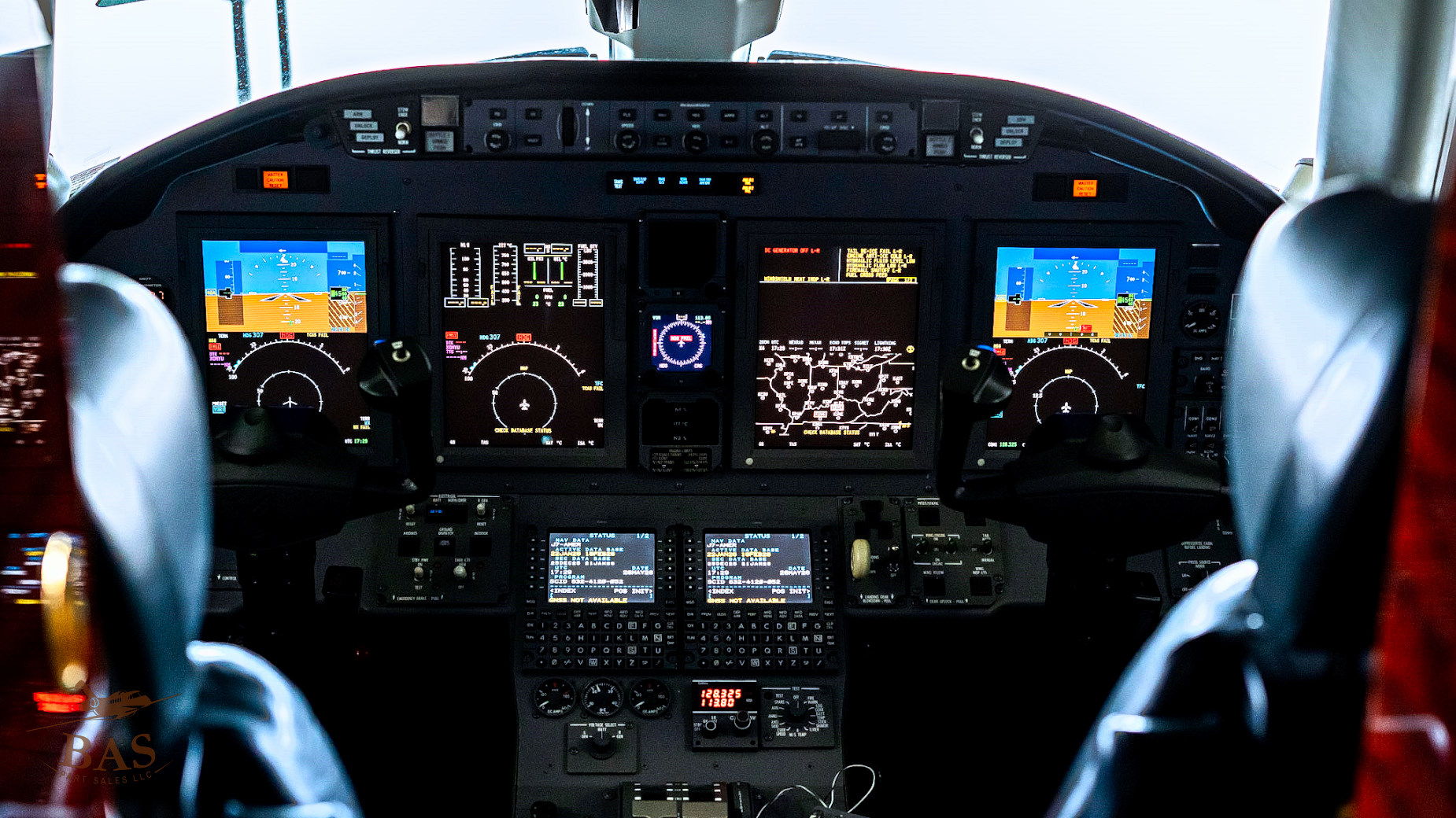 Airplane cockpit with various instruments and displays.