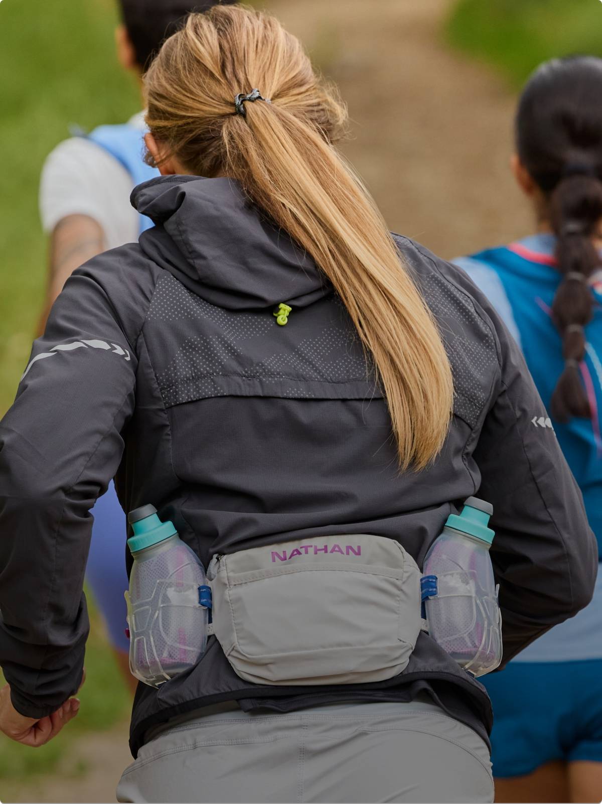 Female runner wearing a Nathan hydration belt