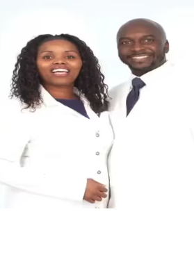 Two smiling professionals in white coats against a plain background.