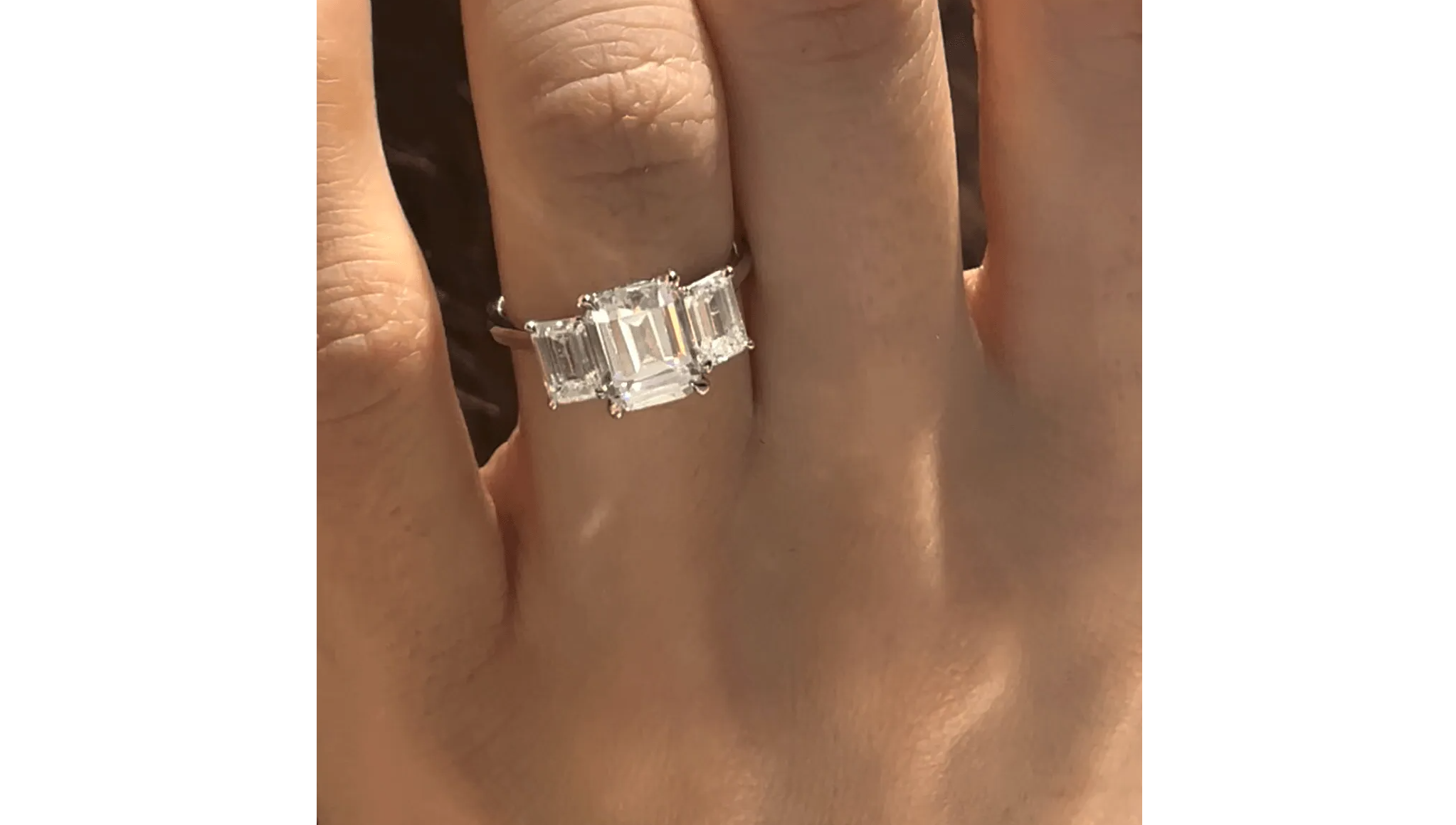 emerald cut three stone engagement ring