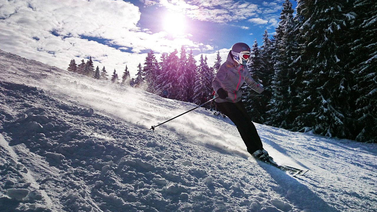 What Are Ski Poles For? | Skier with Ski Poles on a mountain