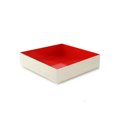A square wooden box with a red felt interior