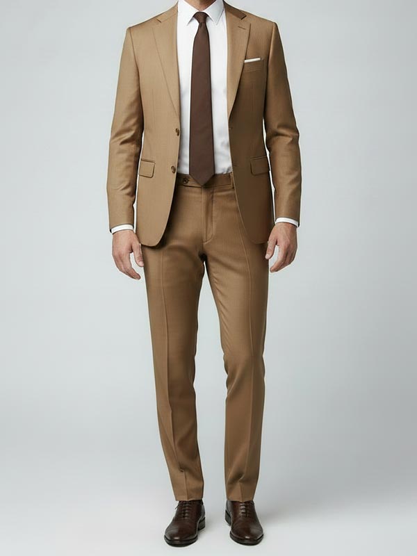 Man wearing a tan suit with a brown tie