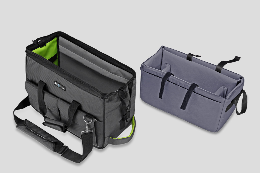 Two organizational bags, one black and one gray, on a gray background.