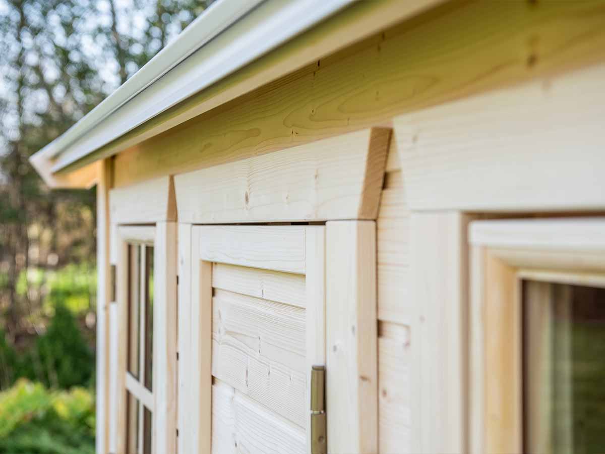 Close-up of handcrafted Wooden Playhouse Natural Wonder with safety glass functional windows by WholeWoodPlayhouses