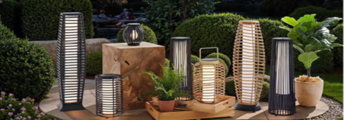 Outdoor scene with various decorative lamps and plants.